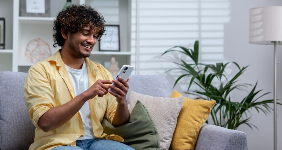 Resident using a home security app on his mobile device